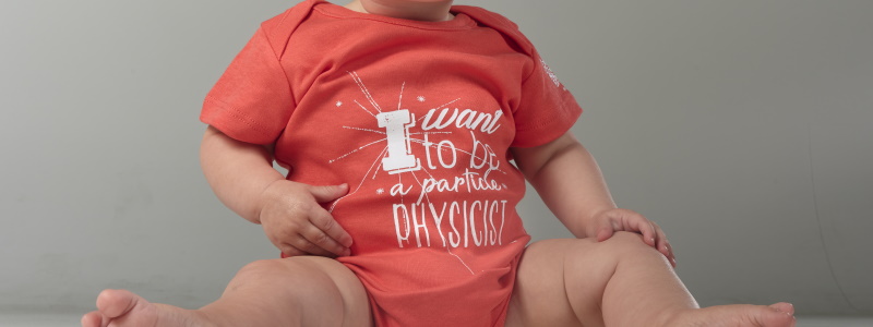 Baby body suit light red "I want to be a particle physicist"